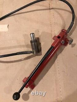 Blackhawk Porto-Power Hydraulic Hand Pump with a cylinder attachment and hose