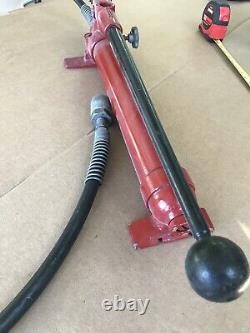 Blackhawk Porto-Power Hydraulic Hand Pump with a cylinder attachment and hose